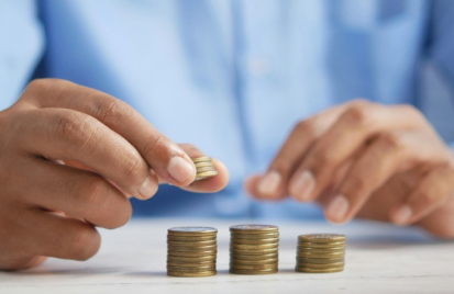 person stacking coins